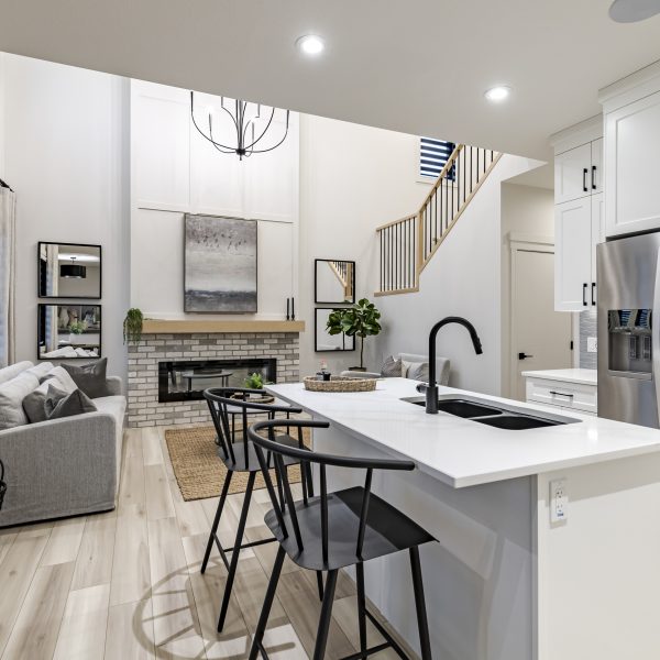 Kitchen and living room in Montorio's showhome in Dansereau Meadows