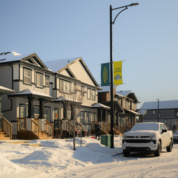 Winter street with banners in Dansereau Meadows, Beaumont, Alberta.